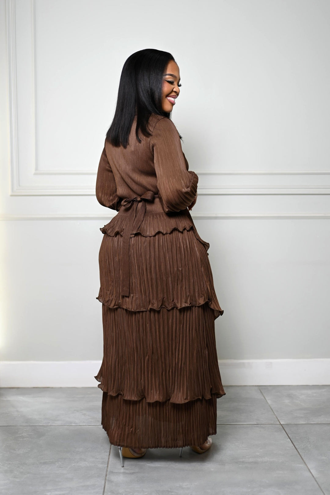 The Plissé Column Dress in brown, side view