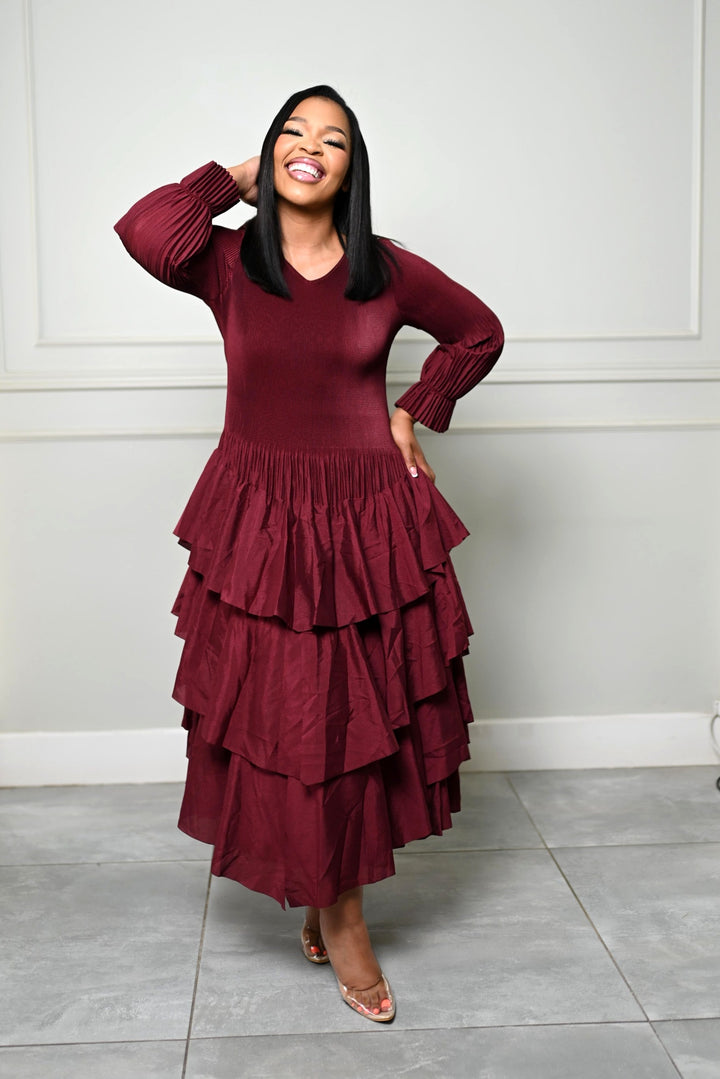 The Merlot Cascade Dress, front view showing the pleated cuffs