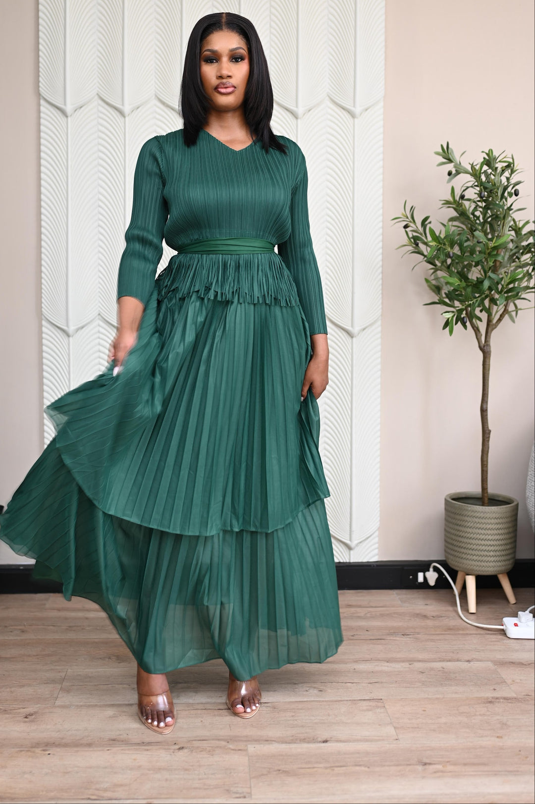 Verdant Whisper Tiered Set in emerald, front view showing the tiered pleated skirt in motion