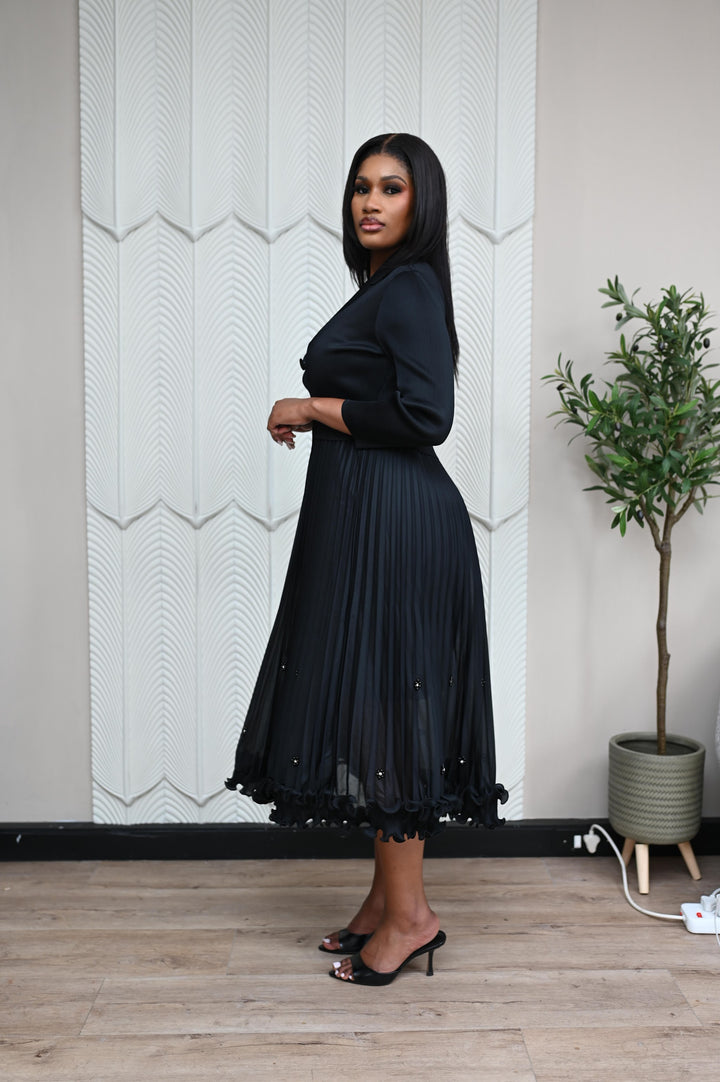 The Executive Muse Dress in black, side view showing the tailored silhouette